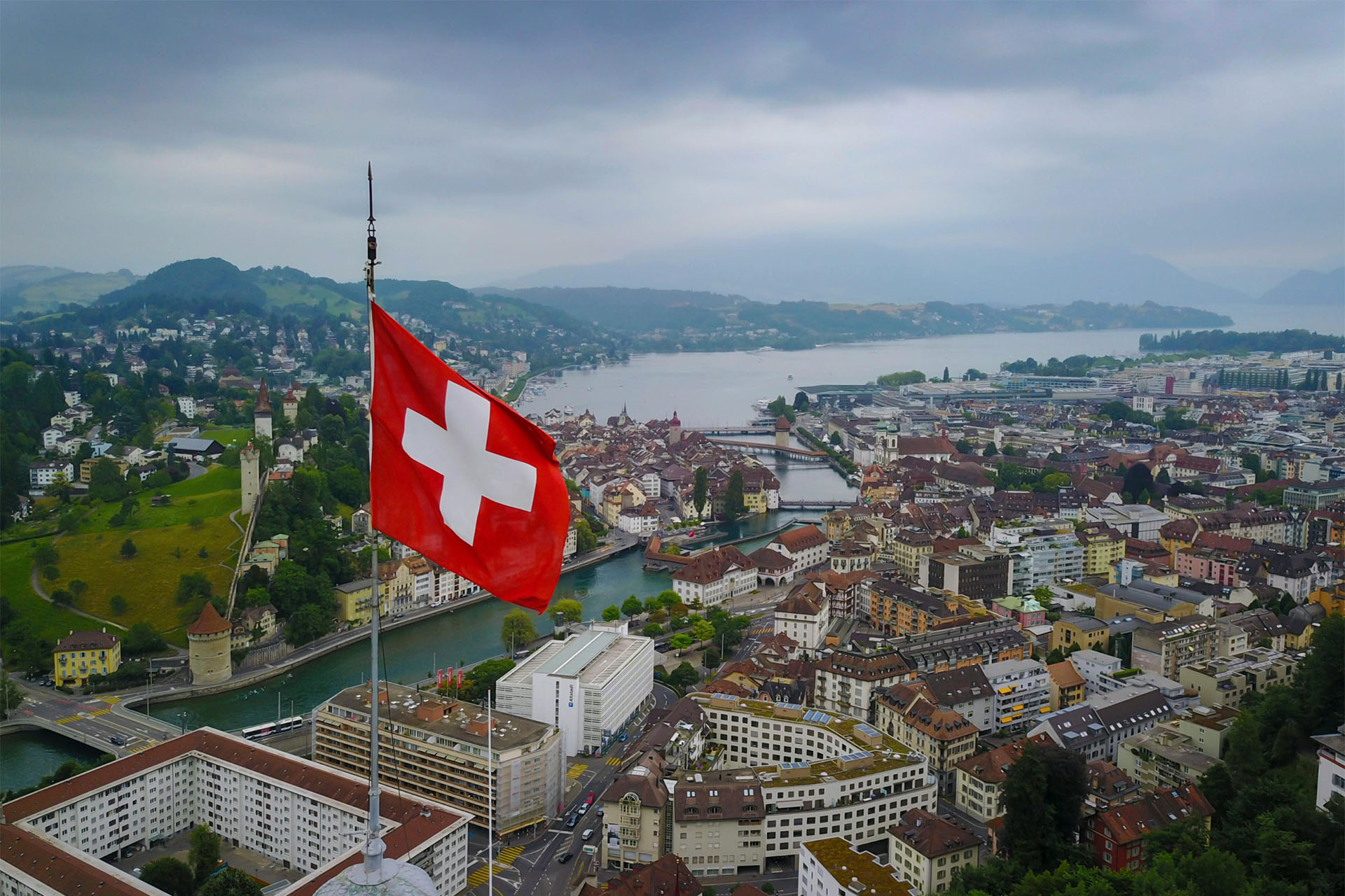 Swiss flag and city views. Prism's office in in Zurich.